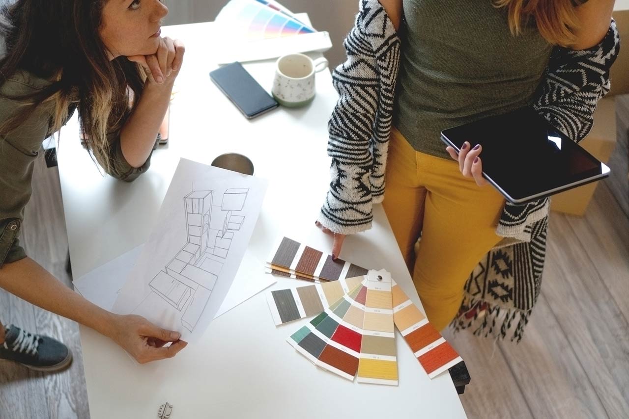 Female designers discussing kitchen renovations