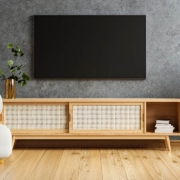 TV and wooden cabinet with gray armchair in modern living room the concrete wall
