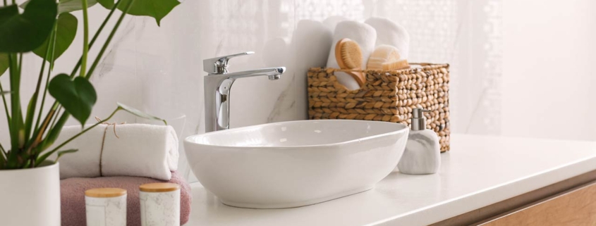 stylish vessel sink on light countertop in modern bathroom
