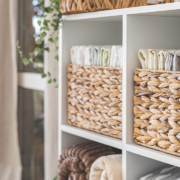 Domestic textile bed linen neatly placed cupboard shelves minimalism Nordic storage method closet organization