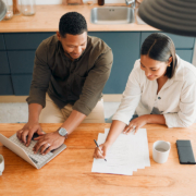 Couple calculating budget, finance and tax while planning investment, loan and bills at home from above