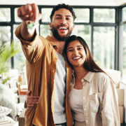 happy home buyers in new home stock photo