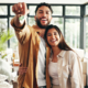 happy home buyers in new home stock photo