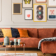 Eclectic living room interior with comfortable velvet corner sofa with pillows stock photo